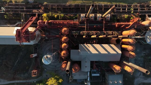 Top down aerial of blast furnace in Alabama USA. Golden hour light.