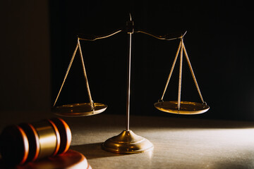 Business and lawyers discussing contract papers with brass scale on desk in office. Law, legal...