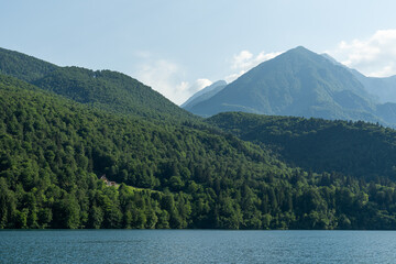 Forrest mountains next to a river in Barcis, Italy