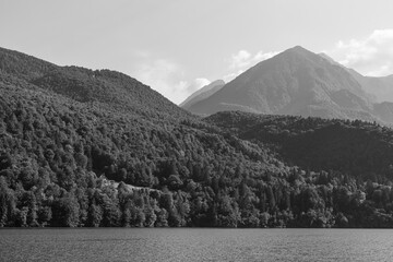 Black and white - Forrest mountains next to a river in Barcis, Italy