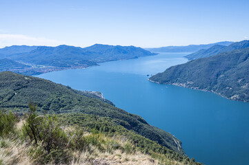 Obraz premium Aerial view of the Lake Maggiore with blue sky from a mountain