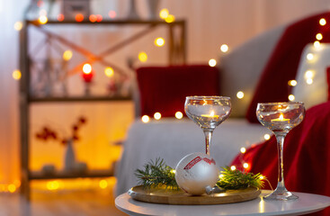 christmas decor in red color with burning candles at home