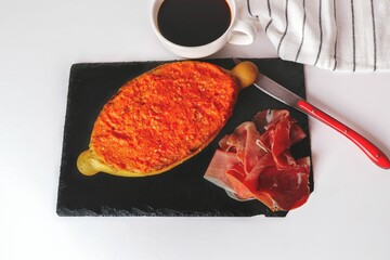 slice of bread with tomato, iberian ham and a cup of coffee typical spanish lunch