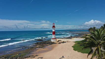 Scenic view of Itapua Lighthouse facing the Atlantic Ocean in the heart of Salvador, Bahia, Brazil 