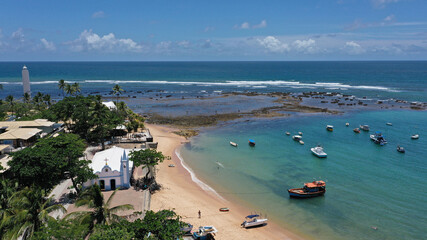 Panoramic view of Praia do Forte beach near Salvador city with fishing boats, palm trees and a...