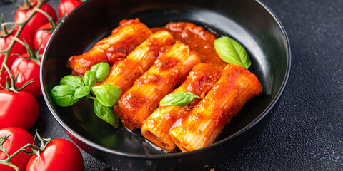 pasta cannelloni tomato sauce dish stuffed meal food snack on the table copy space food background top