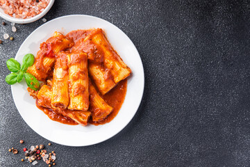pasta cannelloni tomato sauce dish stuffed meal food snack on the table copy space food background top