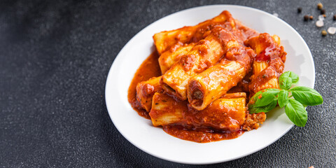 pasta cannelloni tomato sauce dish stuffed meal food snack on the table copy space food background top