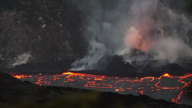 Dark deep vivid red magma smolders in volcano national park | lava post apocolyptic burn fire heat