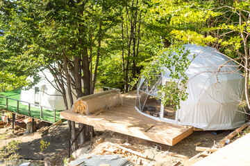 Outside spherical glamping dome. Hemispherical structure lattice shell geodesic polyhedron. Camping house hotel party tent.