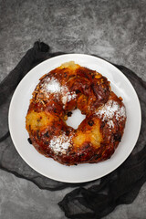 typical portuguese fruit cake Bolo rainha on plate