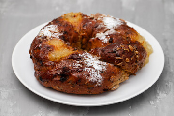 typical portuguese fruit cake Bolo rainha on plate