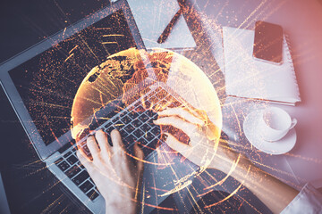 Double exposure of woman hands typing on computer and social network theme hologram drawing. People media concept.