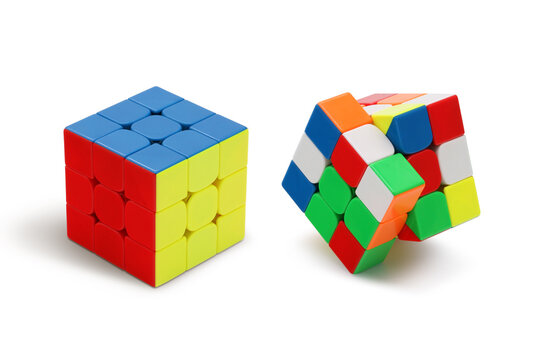 Solved and Unsolved Rubik's cube against a white background
