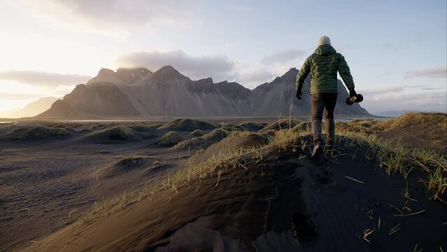 Man Walking To Photograph Mountain Range