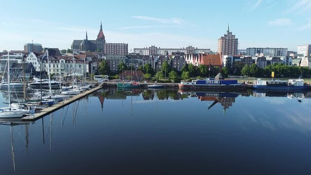 Rostock Harbour & city with Sailing Boats, water reflection on sunny day