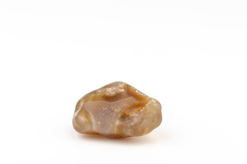 Multicolored gemstones, tumbled minerals. Bostwan agate of various sizes on a white background.