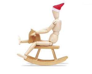 Wooden man in Christmas hat on wooden horse isolated of white background. 