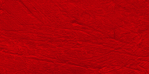Red background with a textured surface. Abstract bright background.
