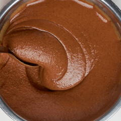 chocolate caramel cream, beating with a spoon, oil cake mixture closeup, taken straight from above...