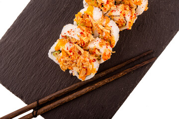 Close up of delicious japanese food with sushi roll  with salmon, tuna,  shrimp with wooden chopsticks  on white background