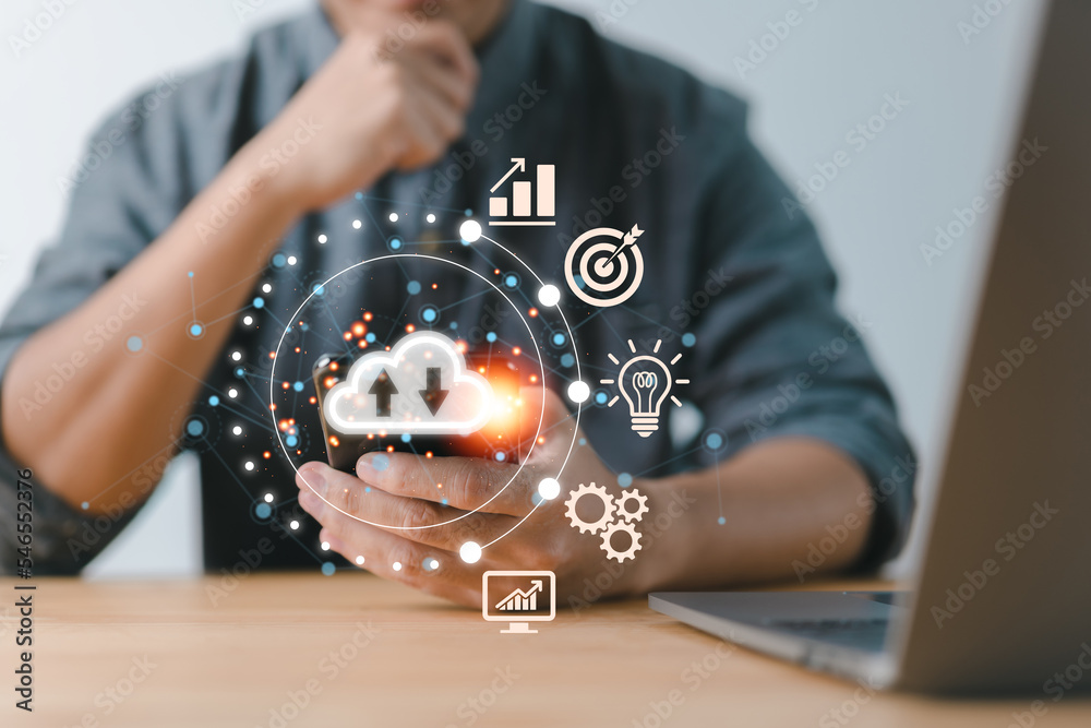 Leinwandbilder Utilizing big data, cloud technology management, and virtual cloud computing on a smartphone with real-world and technological elements like uploading and downloading