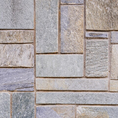 Surface laid with gray granite slabs cut to various sizes.