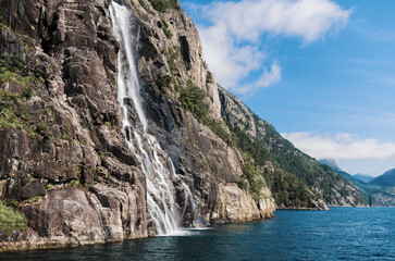 Fototapeta na wymiar Waterfall from Norway's Fjord