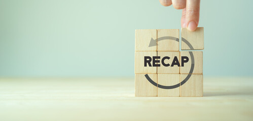 Recap economy, business, financial concept. For business planning. RECAP word icon on wooden cubes...