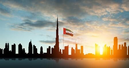 United Arab Emirates flag and Dubai skyline view at sunset. UAE celebration. National day, Flag day, Commemoration day, Martyrs day. - obrazy, fototapety, plakaty