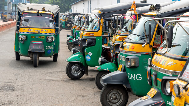 Many CNG-based auto rikshaws are at the taxi stand in Vijayawada, India. Share auto rickshaw is a common and most economical commute in rural India.