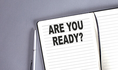 ARE YOU READY word on the notebook with pen