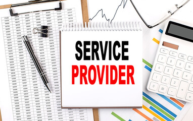 SERVICE PROVIDER text on notebook with chart, calculator and pen