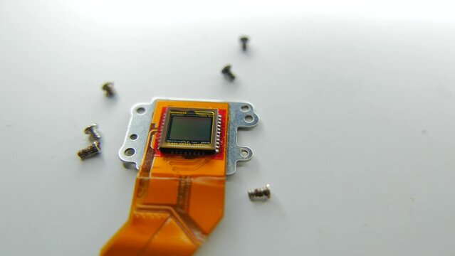 camera matrix with bolts on white background top view