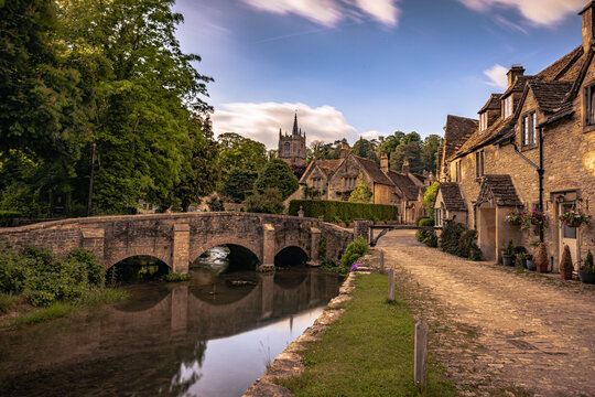 Castle Combe - May 28 2022: Old Cotswolds town of Castle Combe, England.