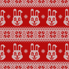 Knitted seamless pattern for 2023 new year of the rabbit. Vector background with cute bunnies, snowflakes and scandinavian ornaments. Red and white sweater print.