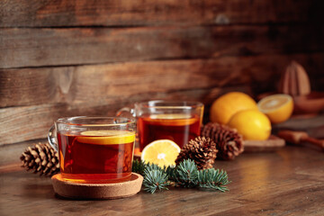 Tea with lemon on a wooden table.