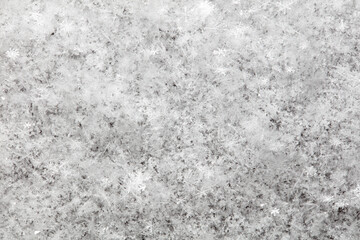 White snowflakes in winter as a background.