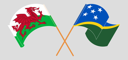 Crossed and waving flags of Wales and Solomon Islands