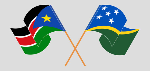 Crossed and waving flags of South Sudan and Solomon Islands