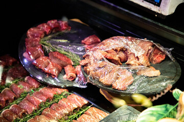 raw meat on the bench in the store