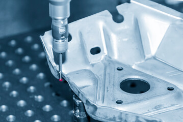 The  multi-axis CMM machine measuring the metal forming press parts.