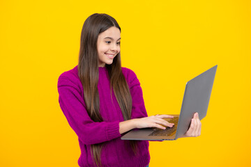 Fototapeta premium Teenager school girl hold notebook laptop. School children on isolated studio background.