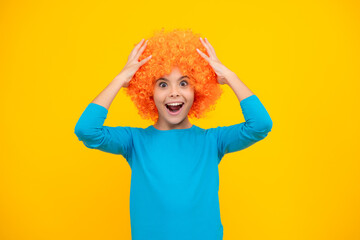 Girls birthday party. Funny kid in curly redhead wig. Time to have fun. Teen girl with orange hair, being a clown. Excited teenager, glad amazed and overjoyed emotions.