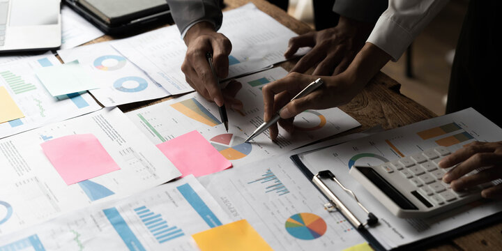 Asian Business Adviser Meeting To Analyze And Discuss The Situation On The Financial Report In The Meeting Room.Investment Consultant,Financial Consultant,Financial Advisor And Accounting Concept