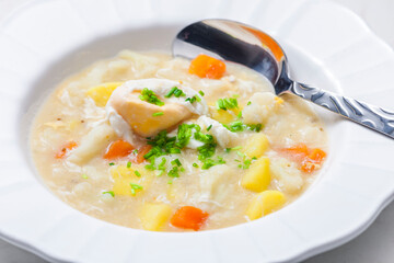 cauliflower soup with carrot, potatoes and poache egg