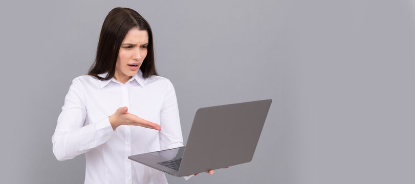 Woman isolated face portrait, banner with mock up copy space. indignant programmer use pc. businesswoman with laptop. network administrator hold computer.