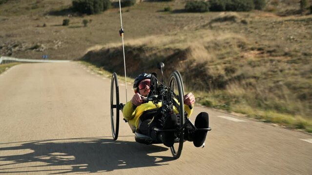 Athlete with disability training with His Handbike on a Track. High quality 4k footage
