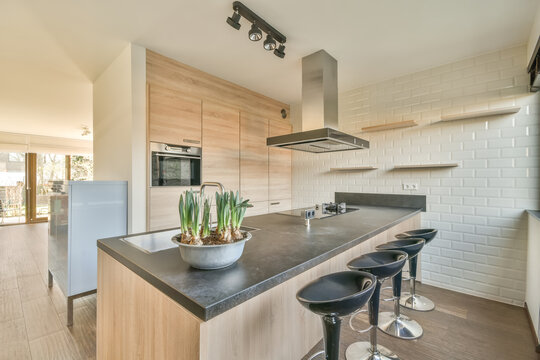 Interior of spacious kitchen in daytime at home