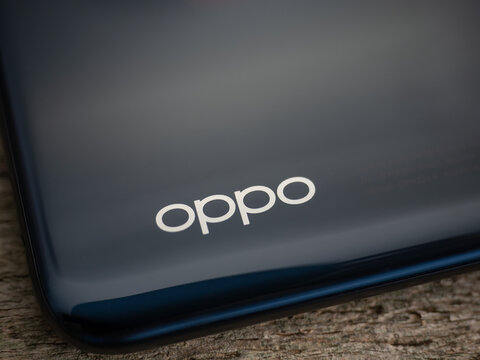 Galati, Romania - November 11, 2022: Recently launched Oppo smartphone with triple camera on the back with focus on the the Oppo brand logo on the back